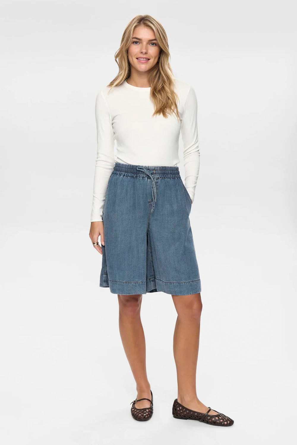 NÜMPH Nuelida Shorts in Snow Washed Denim – women's relaxed fit washed denim shorts, available at Pukas Surf Shop