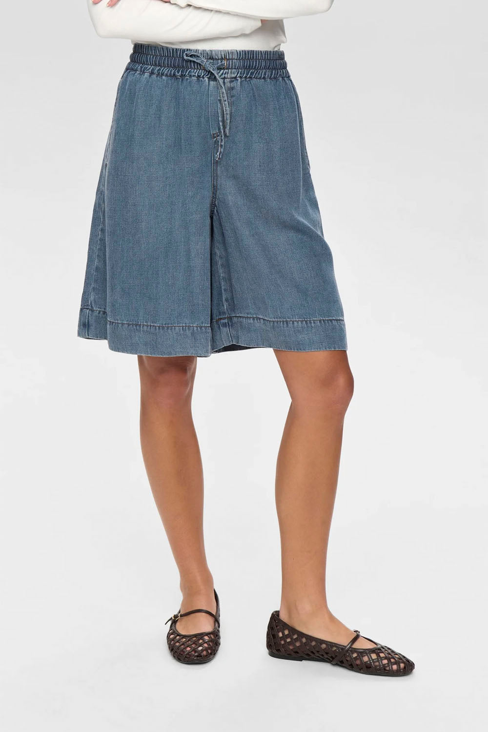 NÜMPH Nuelida Shorts in Snow Washed Denim – women's relaxed fit washed denim shorts, available at Pukas Surf Shop