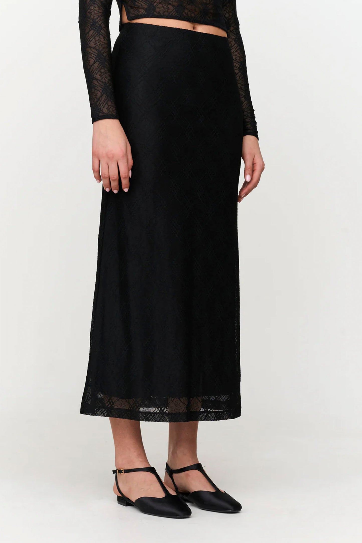 Textured black midi skirt with structured fit and minimal elegant design