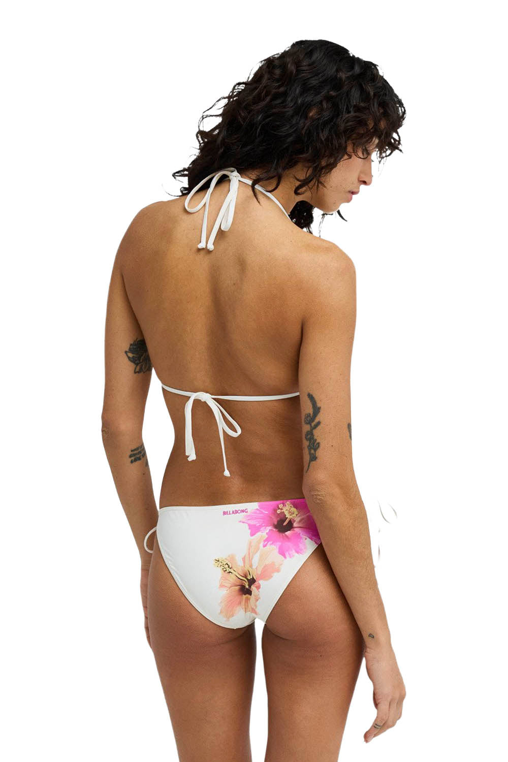 Woman wearing a floral bikini on a white background