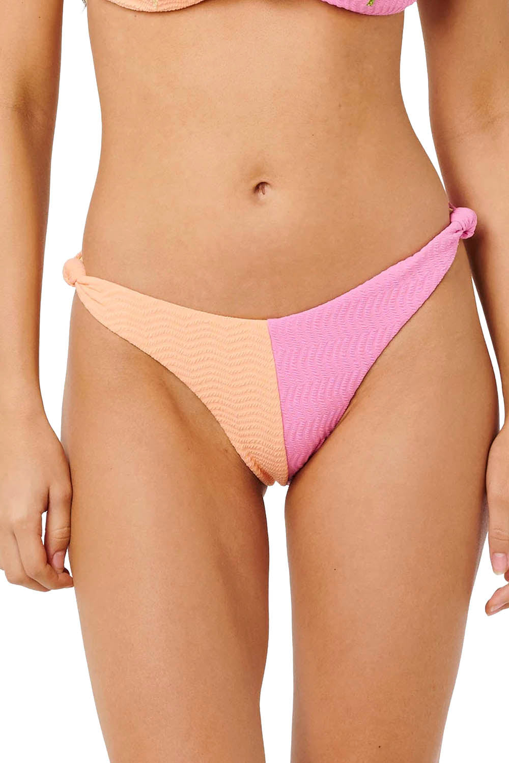 Pink and peach bikini bottom on a plain background