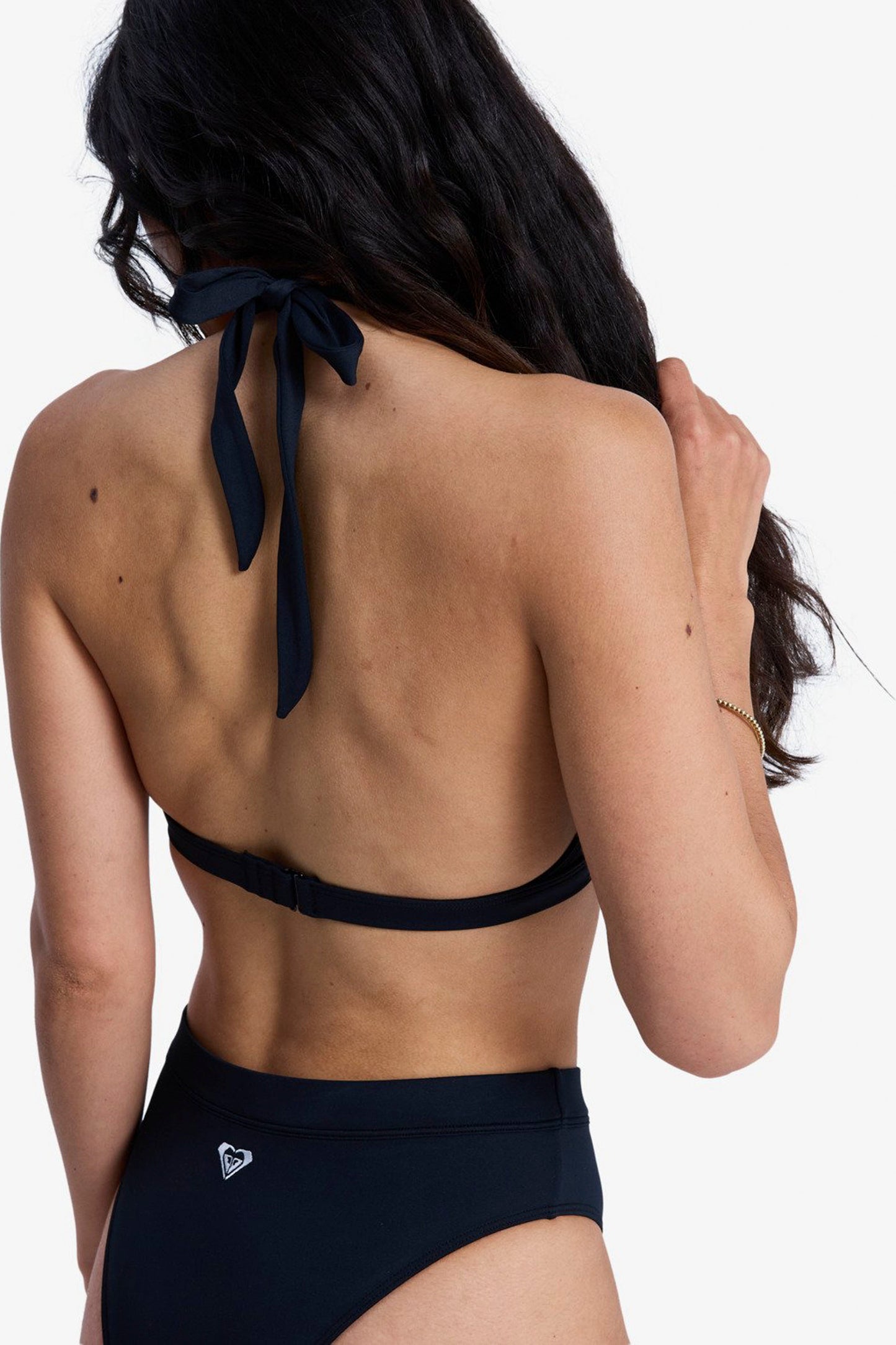 Person wearing a black bikini with a white background