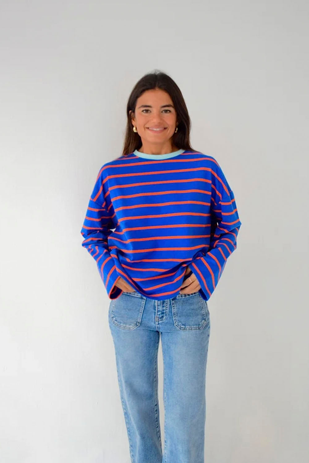 Mind Traveler BCN Miriam women's long sleeve tee in blue with orange stripes and a contrasting pale blue crew neck
