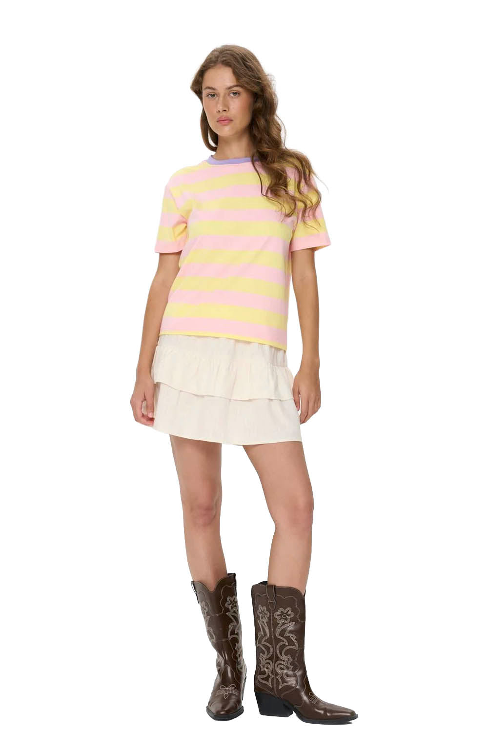 Woman wearing a striped shirt, skirt, and boots on a white background