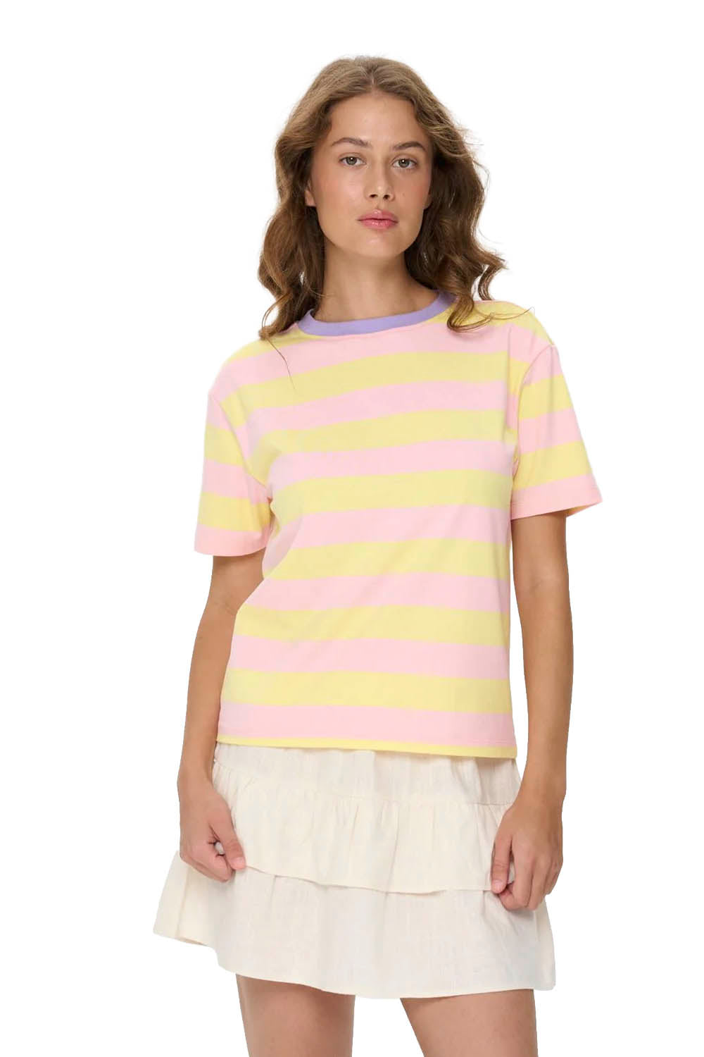 Woman wearing a pastel striped shirt and white skirt on a white background