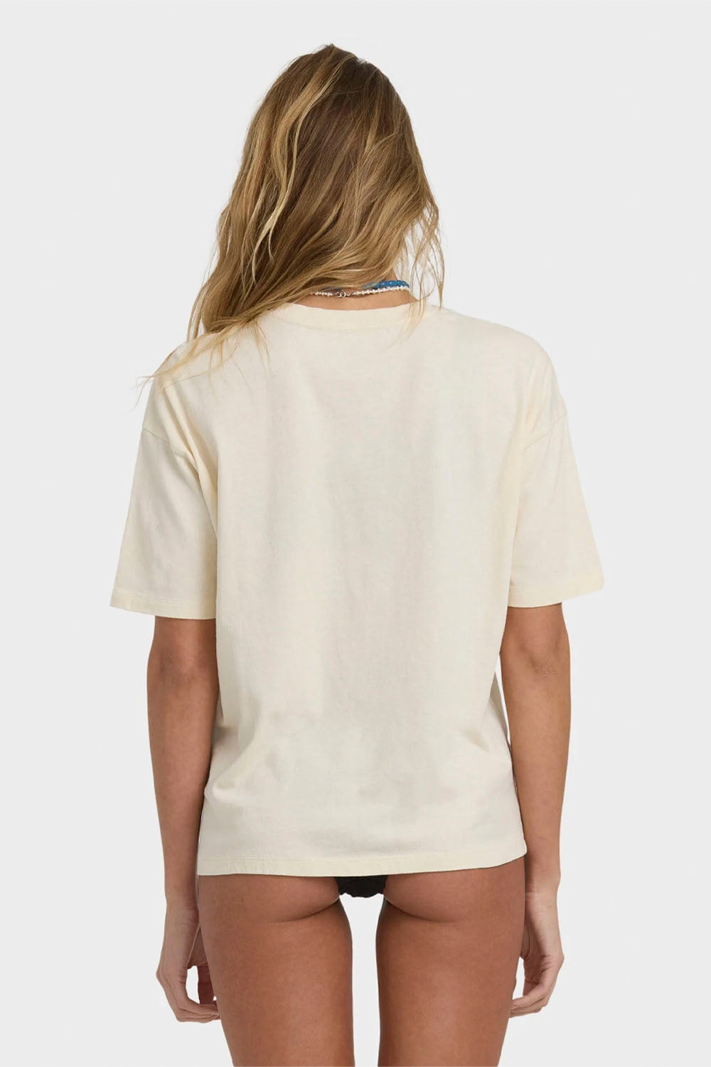 Person wearing a beige t-shirt on a white background