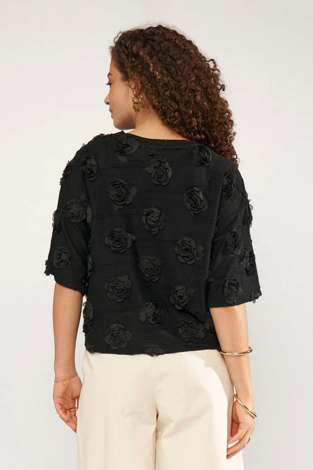 NÜMPH Nurosie T-Shirt in Caviar – women's relaxed fit black tee, available at Pukas Surf Shop
