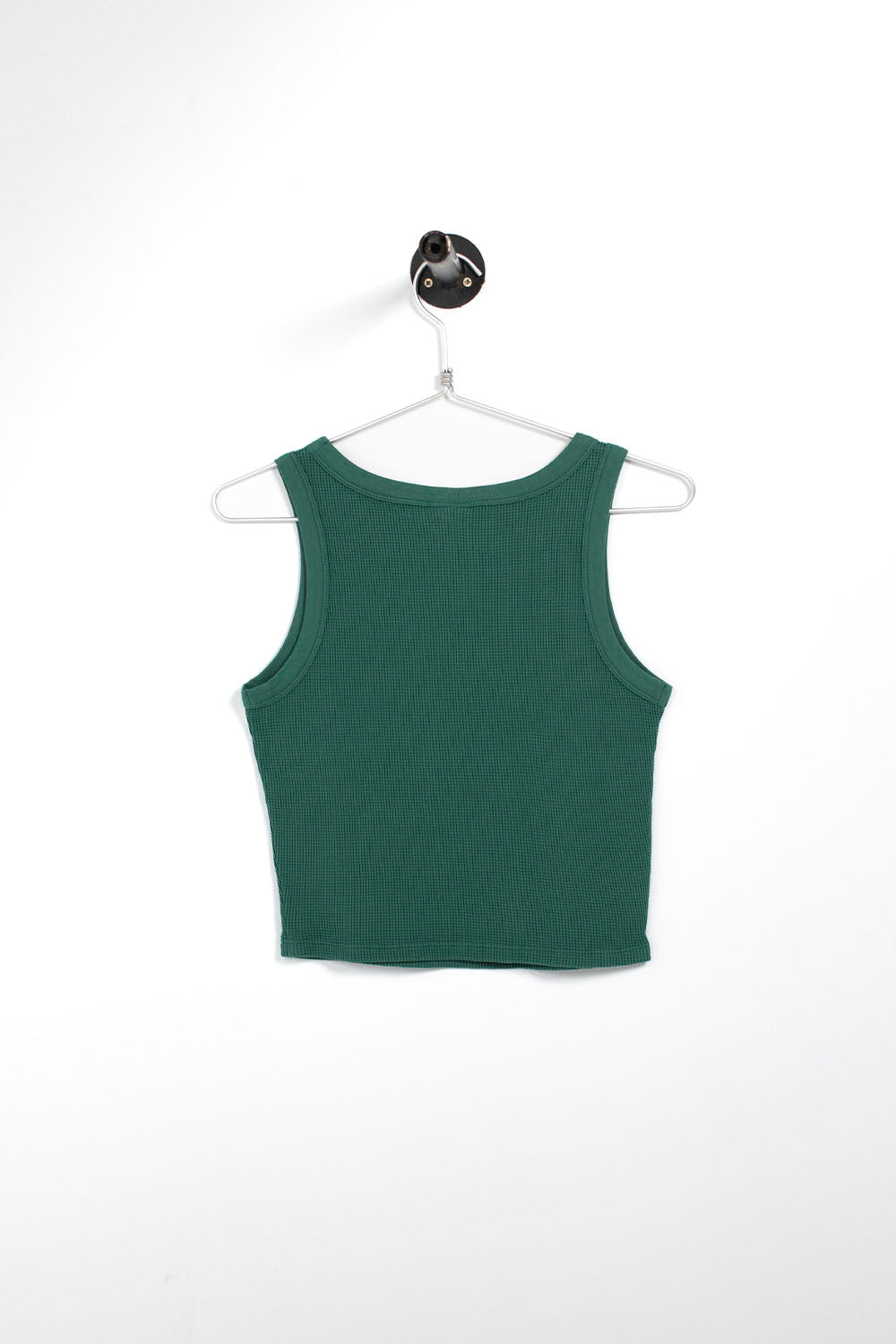 A dark green ribbed tank top hanging on a white wire hanger against a plain white background.