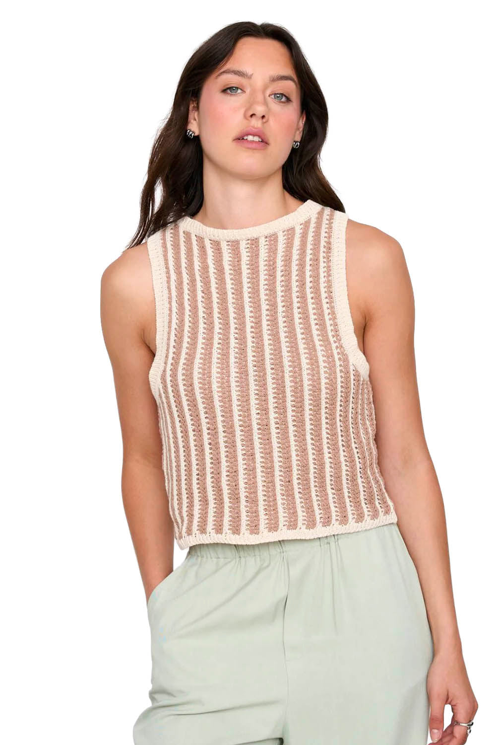 Woman wearing a beige and white striped sleeveless top with light green pants on a white background