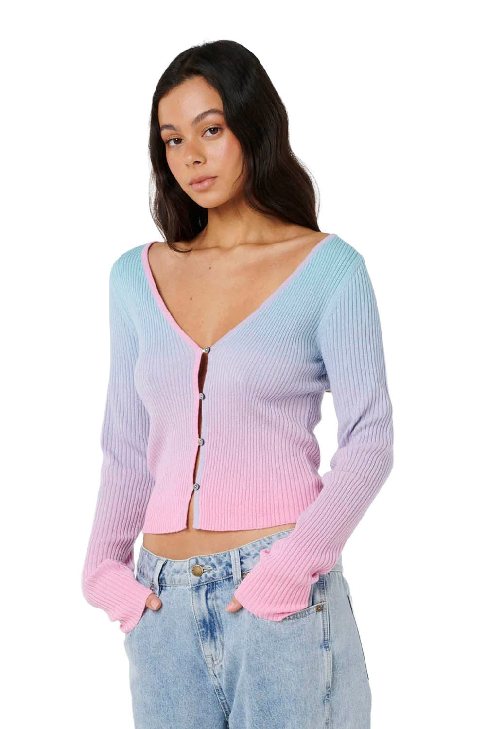 Woman wearing a pastel gradient cardigan on a white background
