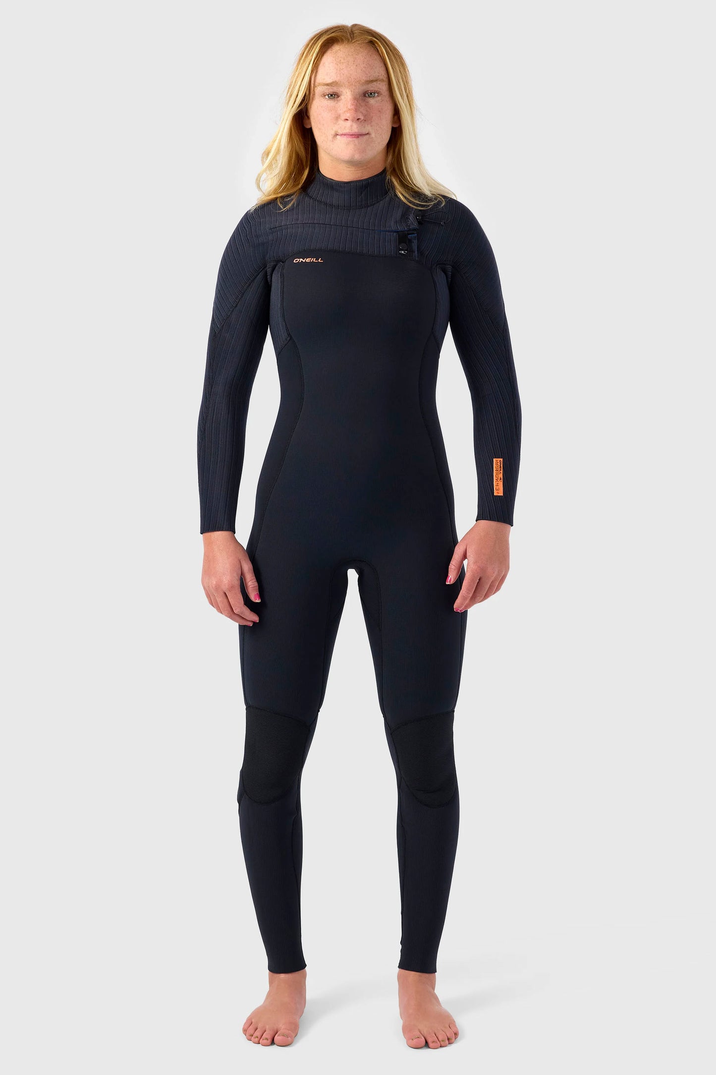 Person wearing a black O'neill Hyprfreak 3/2+ mm wetsuit on a white background
