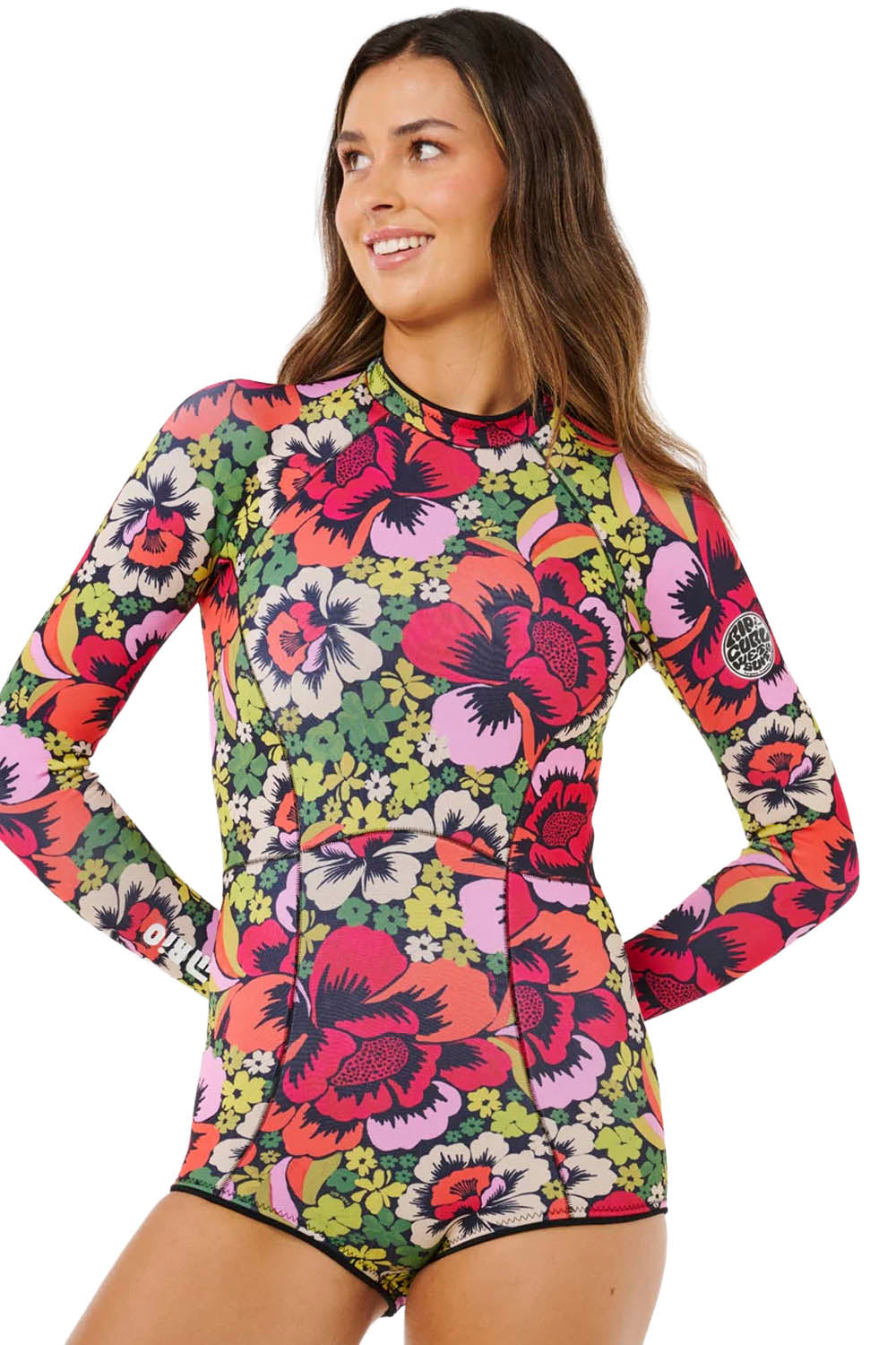 Woman wearing a colorful Rip Curl G-bomb 1.5mm back zip springsuit on a white background