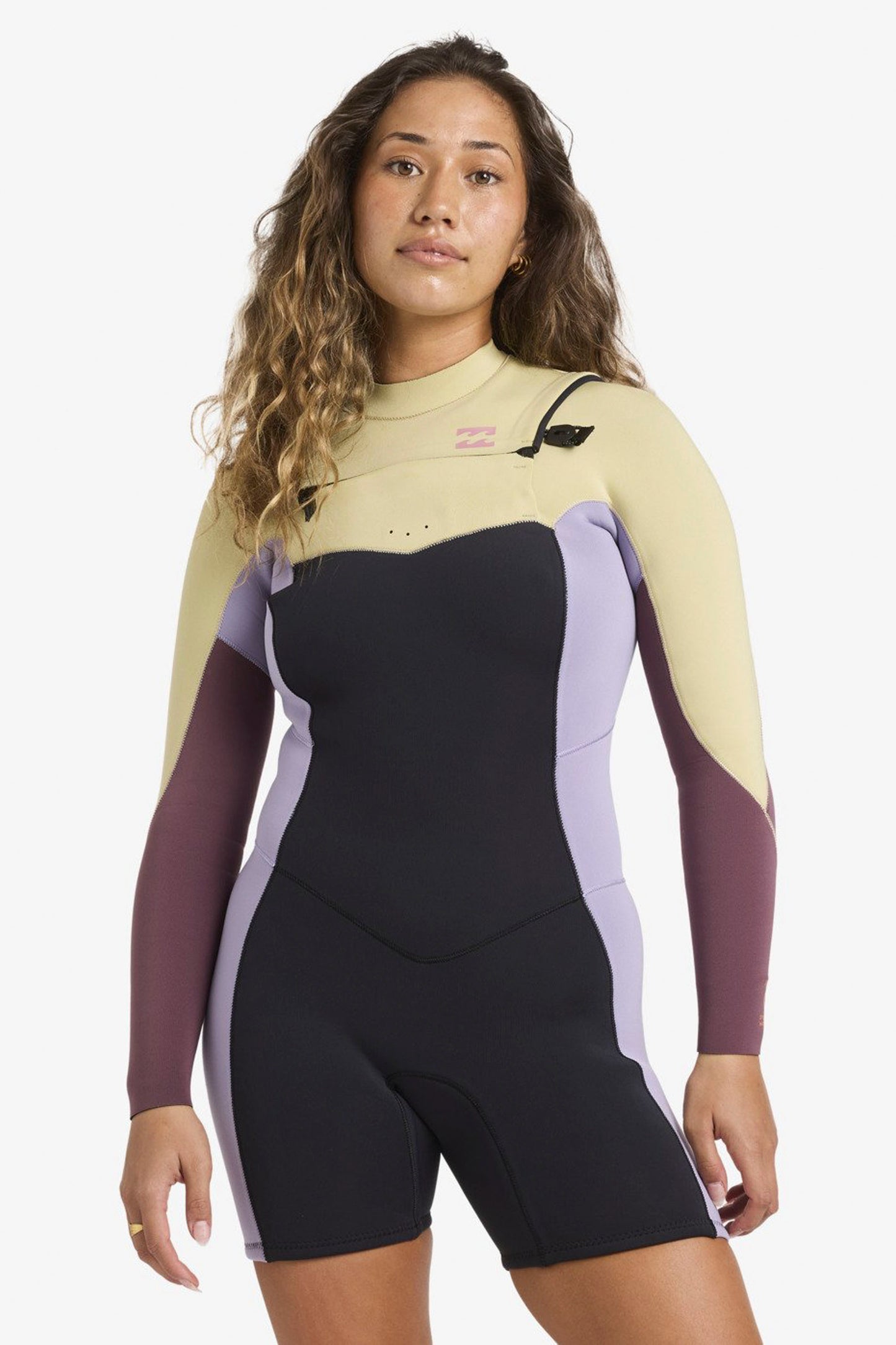 Woman wearing Billabong Synergy springsuit on a white background