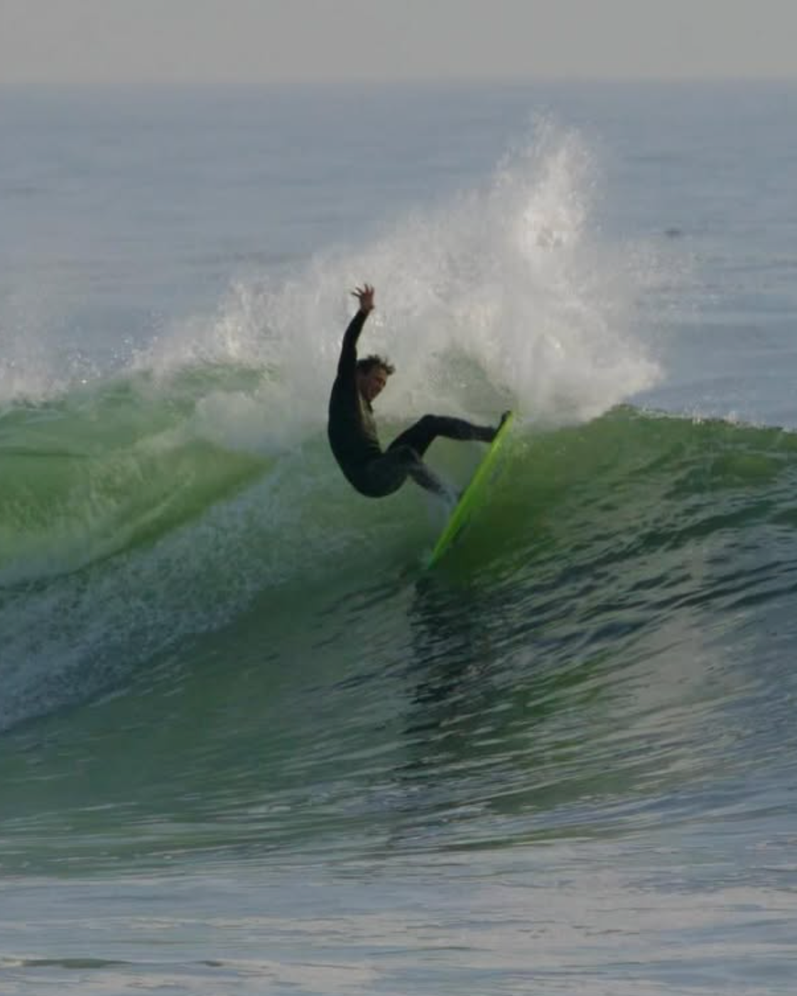 Surfer riding a wave in the ocean