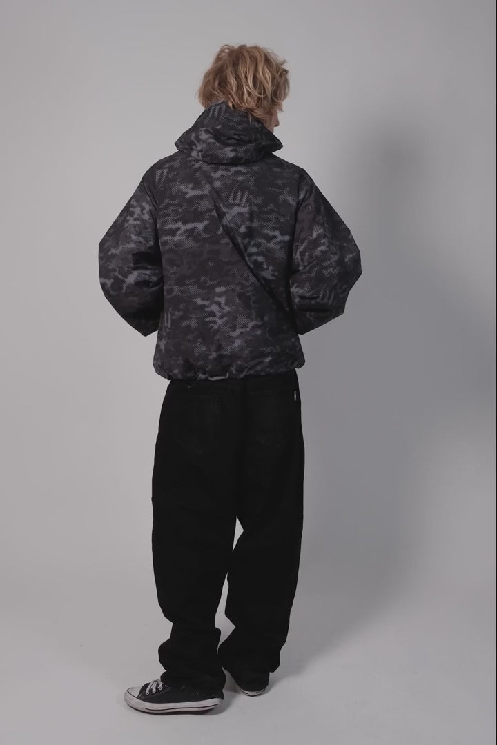 Wasted Paris Close-up of a black and gray camo patterned windbreaker Pukas Surf Shop